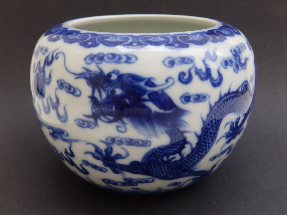 A Chinese blue & white porcelain dragon jar, two confronting Imperial dragons chasing the flaming