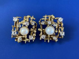 A pair of 1970's certified natural saltwater pearl & diamond set clip-on earrings in yellow metal,