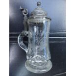 A German engraved glass stein with pewter lid, 9.5" high overall.