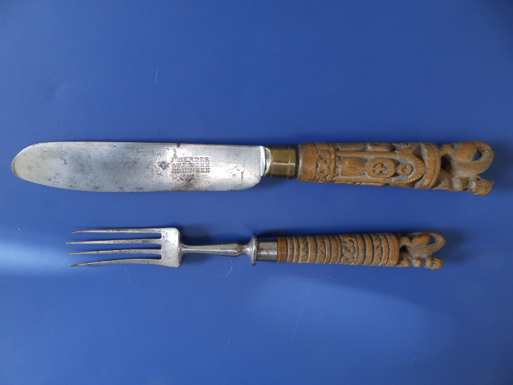 Two 19thC Dutch table knives, having bold tapering carved wooden handles, each surmounted by two - Image 4 of 5