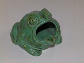 A green Glazed Dartmouth Pottery frog ashtray, 4" across.