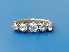 A graduated five stone old cut diamond ring. Finger size L.