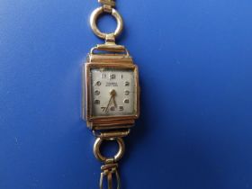 A ladies 18ct gold Concordia wrist watch with rectangular dial, case width 15mm - case bruised, on