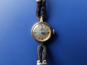 A ladies gold Omega wrist watch, case diameter 16mm.