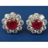 A pair of Burmese ruby & diamond cluster earrings in 18ct gold, overall diameter approximately