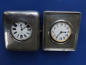 Two silver travelling watch cases with Goliath watches - one dial cracked.
