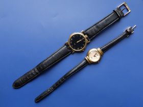 A gold plated gent's Gucci black dial quartz dress watch, case diameter 30mm and a ladies Gucci