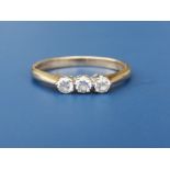 A small three stone diamond set 9ct gold ring. Finger size P.