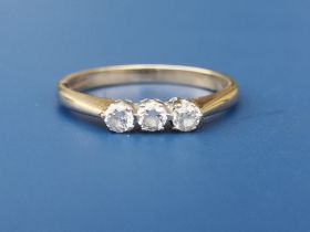 A small three stone diamond set 9ct gold ring. Finger size P.