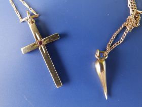 A 9ct gold cross pendant set with a small red stone, 1.1" on gold necklace chain and one other 9ct