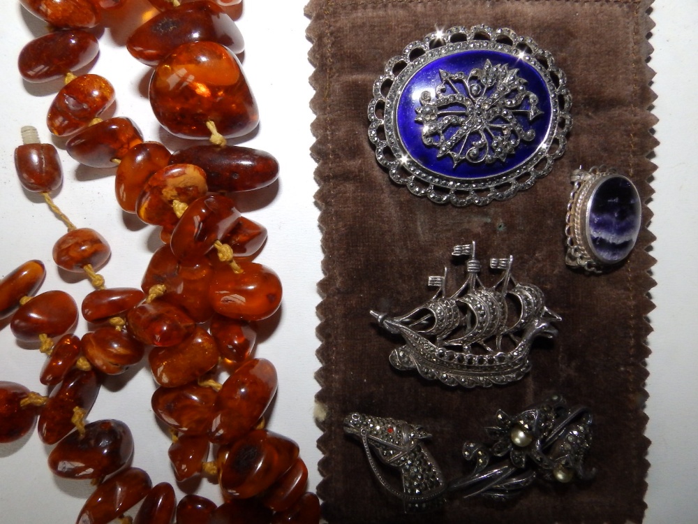 A leather jewellery, four marcasite brooches, two others and a string of irregular amber coloured - Image 2 of 2