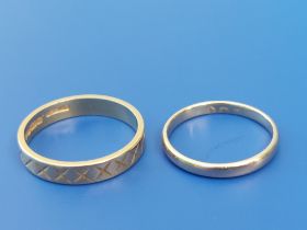 A patterned 22ct gold wedding ring, finger size N/O and a small old gold wedding ring, finger size