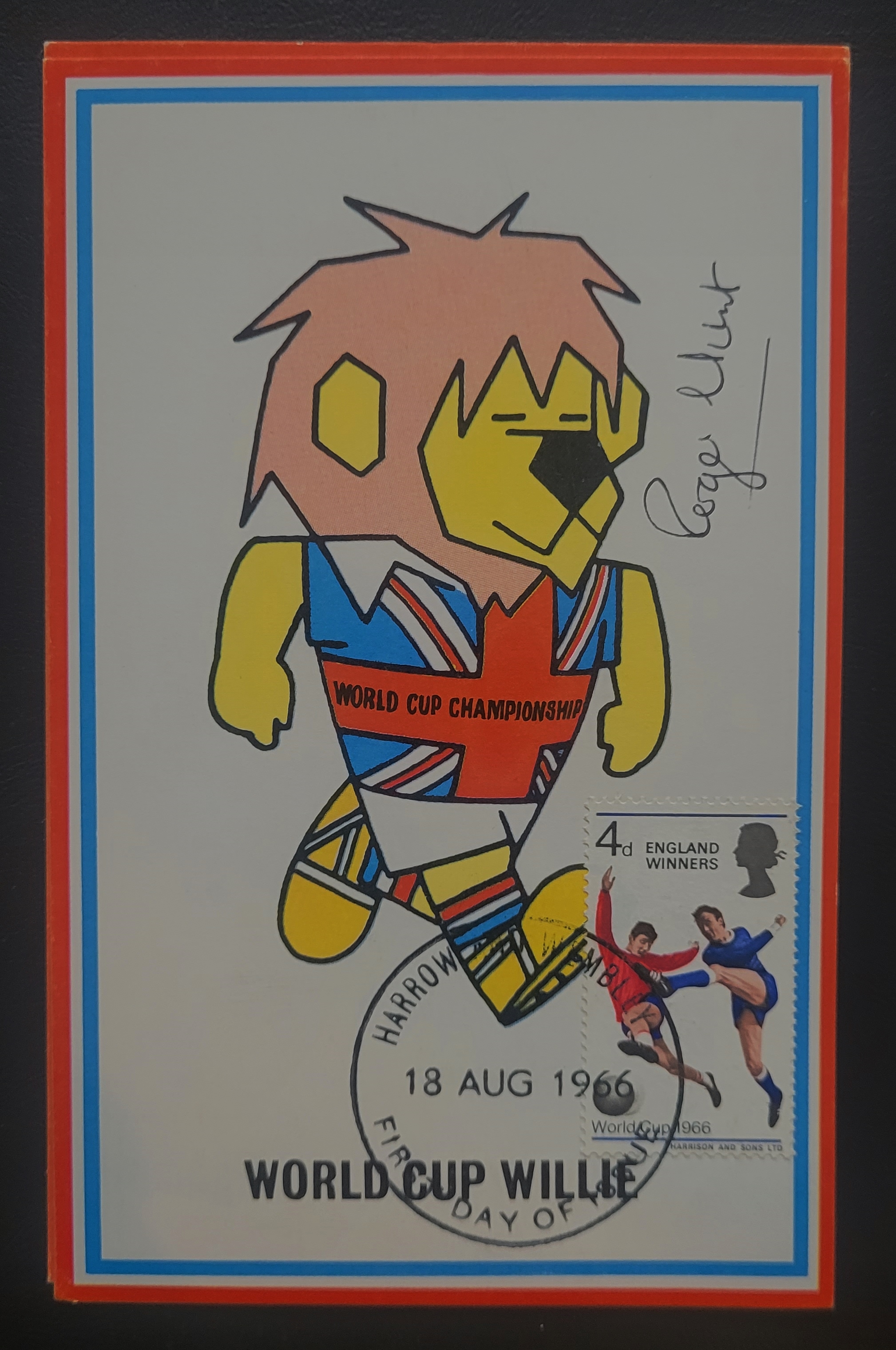 1966 ORIGINAL WORLD CUP WILLIE POSTCARD STAMPED HARROW & WEMBLEY AND SIGNED BY ROGER HUNT