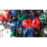 SPORTS GARMENTS X 50 PLUS ALL ADULT SIZE. ITEMS FROM UNITED STATES, CANADA, AUSTRALIA & BRITAIN