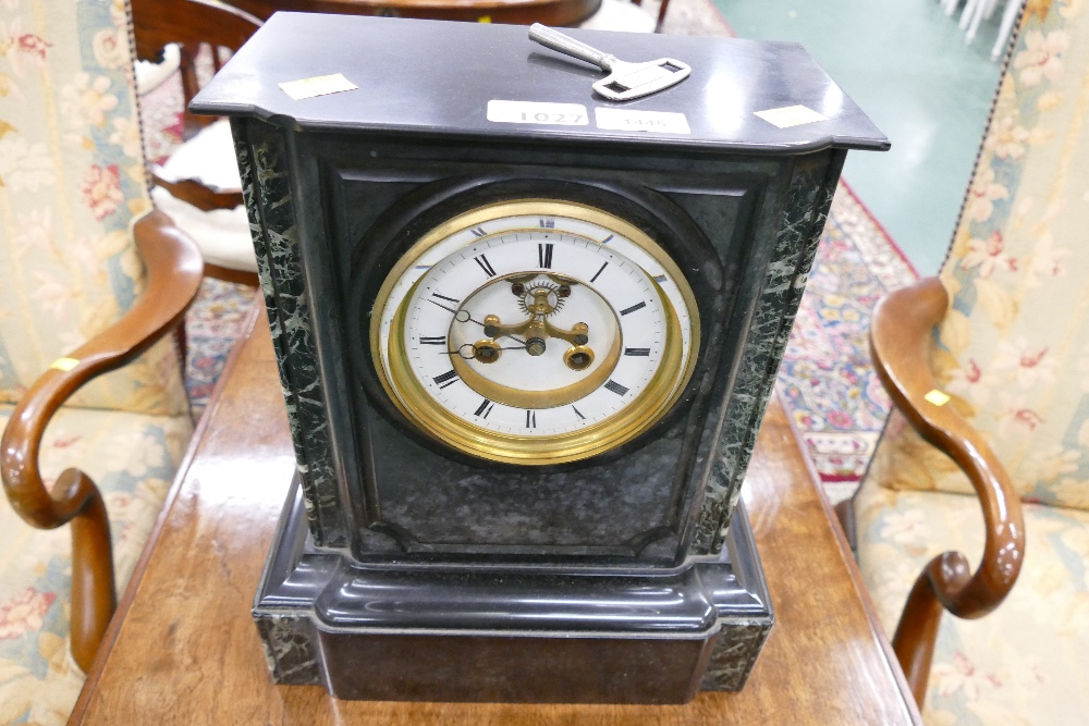 A 19th century black slate and marble mantel clock with visible brocot escarpment to the enamelled