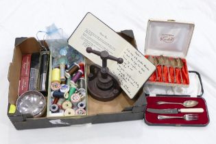 Box of sewing threads, buttons, cast iron press, razors,