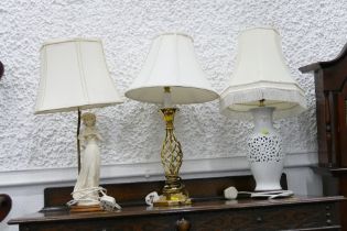 Three lamps, brass based pierced white ceramic base and figural base,