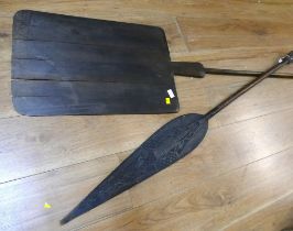 Ornamental wooden tribal spear and a large wooden bread shovel / peel