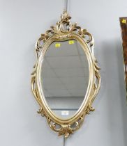 Ornate oval wall mirror,