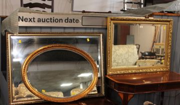 Three mirrors in gold coloured frames,