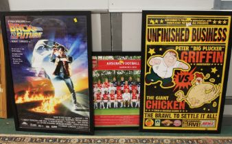 Three framed posters, Back to The Future, Family Guy and Arsenal Football Club,