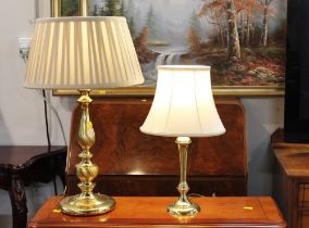 Two brass based column lamps with shades