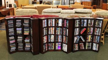 Three folding sectional DVD & CD storage units with contents,