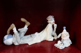 Large Lladro reclining clown and small seated clown