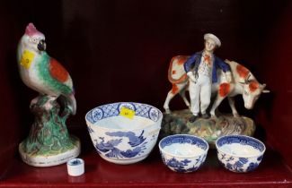 Two Staffordshire figures and small quantity of blue and white tea bowls etc