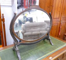 Oval dressing table mirror on scrolled stand