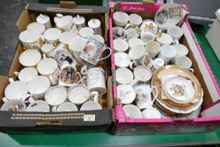 Two boxes of commemorative mugs, plates, trinket dishes,