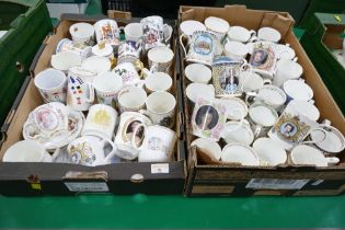 Two boxes of commemorative mugs and cups
