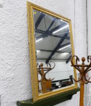 Large wall mirror in ornate gold coloured frame,