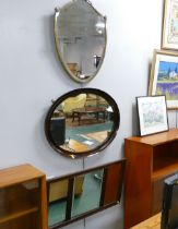 Shield form wall mirror in brass frame and two wooden framed mirrors
