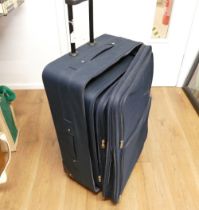 Three graduating wheeled suitcases