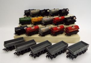 Fifteen Hornby 00 fuel tankers and five Wrenn hopper wagons