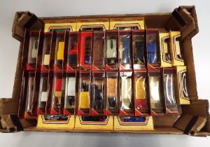 Collection of approximately 30 boxed diecast vehicles,