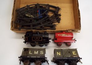 Hornby O gauge train set 0-4-0 clock work LMS locomotive, brake van, goods van and tanker, track,