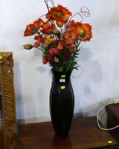 Marks & Spencers vase containing artificial poppies,