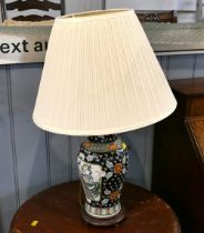 Oriental style ceramic lamp base with cream shade,