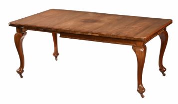 An Edwardian Queen Anne style extending dining table with single leaf,