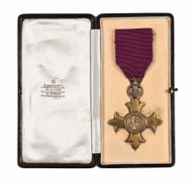 A George V O.B.E. medal, presented to Harry Stowe Coppock 1918, cased. Weight 23 grams.