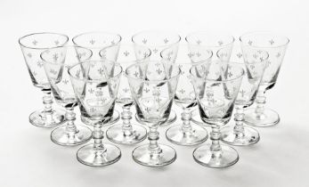 A set of twelve vintage fleur de lis patterned wine glasses. 12.5 cm high.