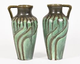 A pair of studio pottery jugs, with green starburst drip glaze decoration, marked to the base R.