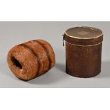 An early 20th century fur muff, in original cylindrical box.