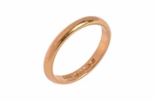 A 22 ct gold band, weight 4.1 grams. Size P.