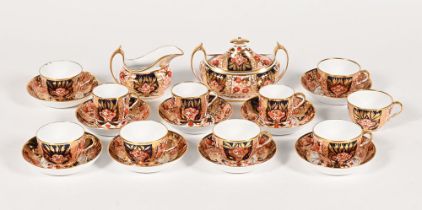 A part tea set in the manner of Derby, comprising milk jug, sugar basin, nine saucers,