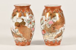 A pair of Kutani vases, decorated with birds to include peacocks, pheasants,
