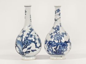 Two Oriental blue and white vases, decorated with birds and flowers,