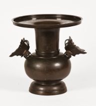 A Chinese bronze vase, with detachable butterfly handles the body marked with pheasant, horses etc.